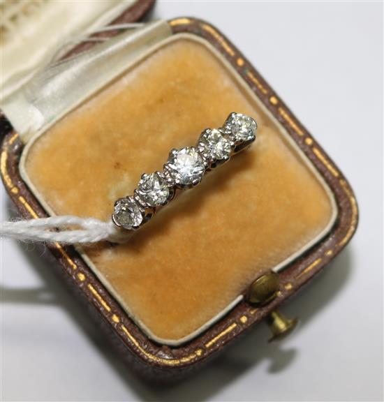 An early 20th century 18ct gold and graduated five stone ring, size O.